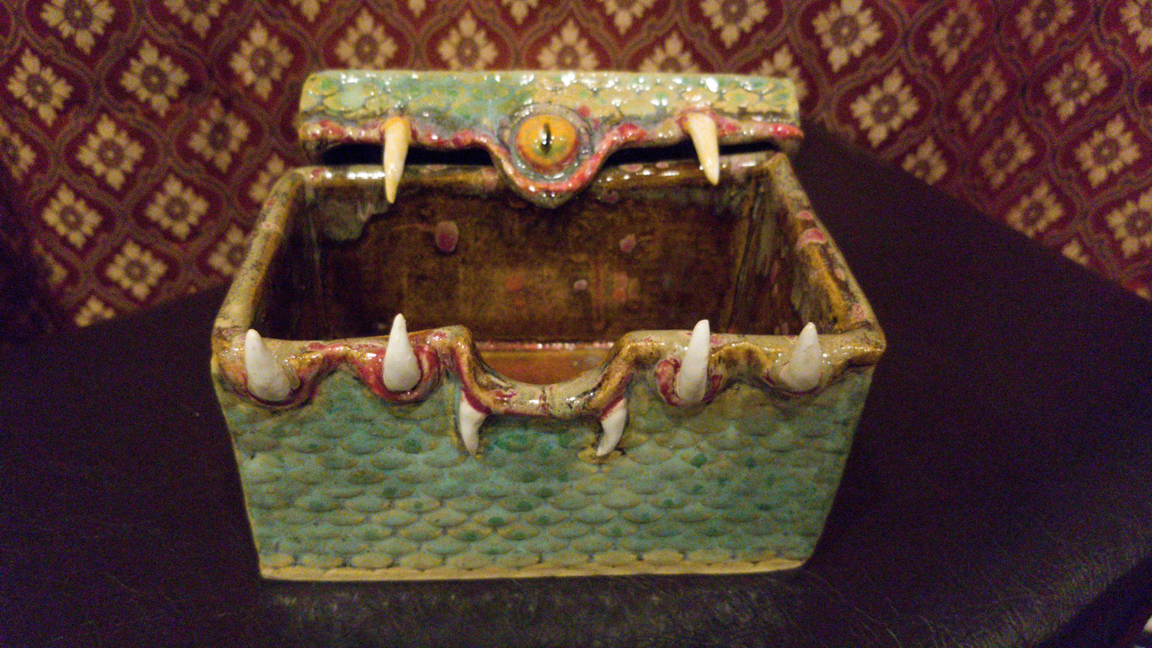 Handcrafted monster box shown open with interior details
